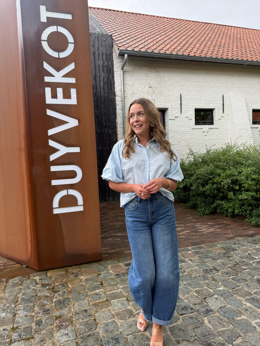 Blauwe blouse met ballonmouw & detailknopen