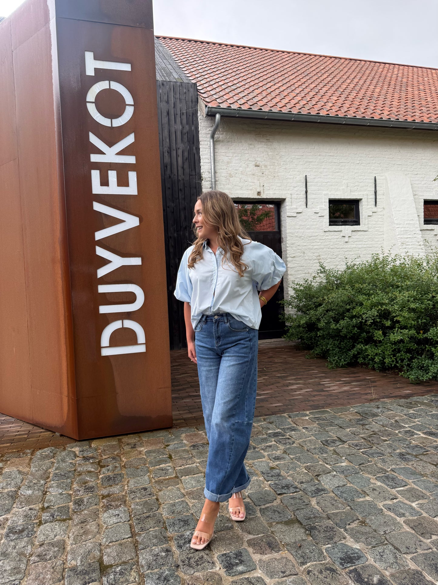 Blauwe blouse met ballonmouw & detailknopen